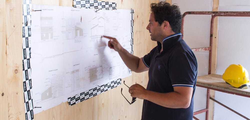 Reviewing drawings on site, from the MANINI Villae guide.